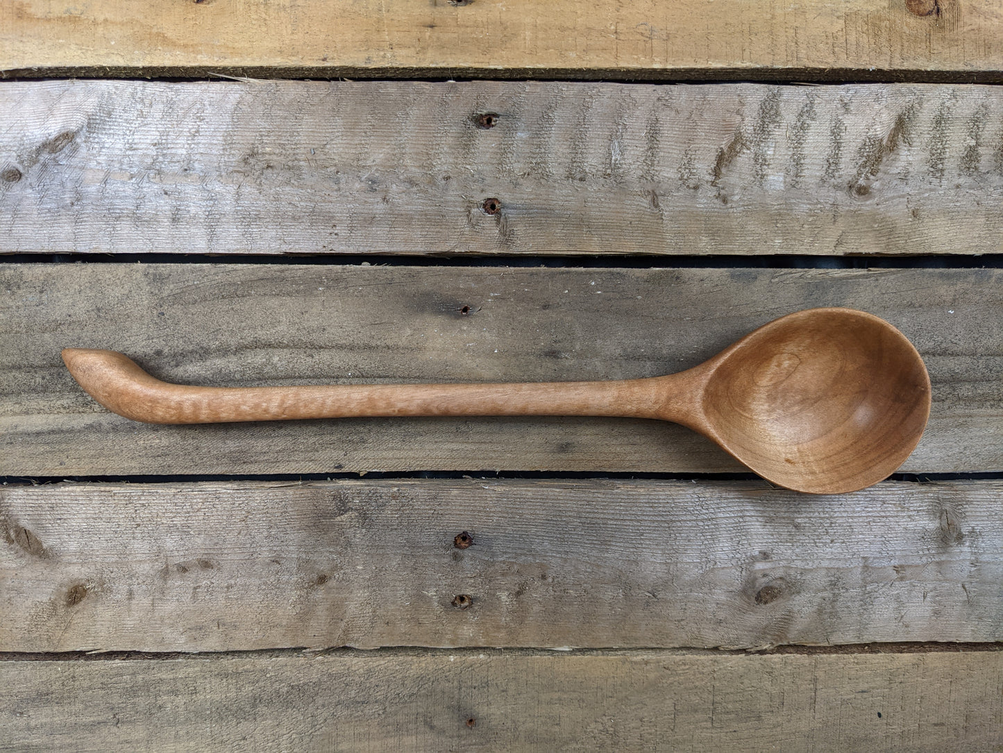 Long handled wooden spoon