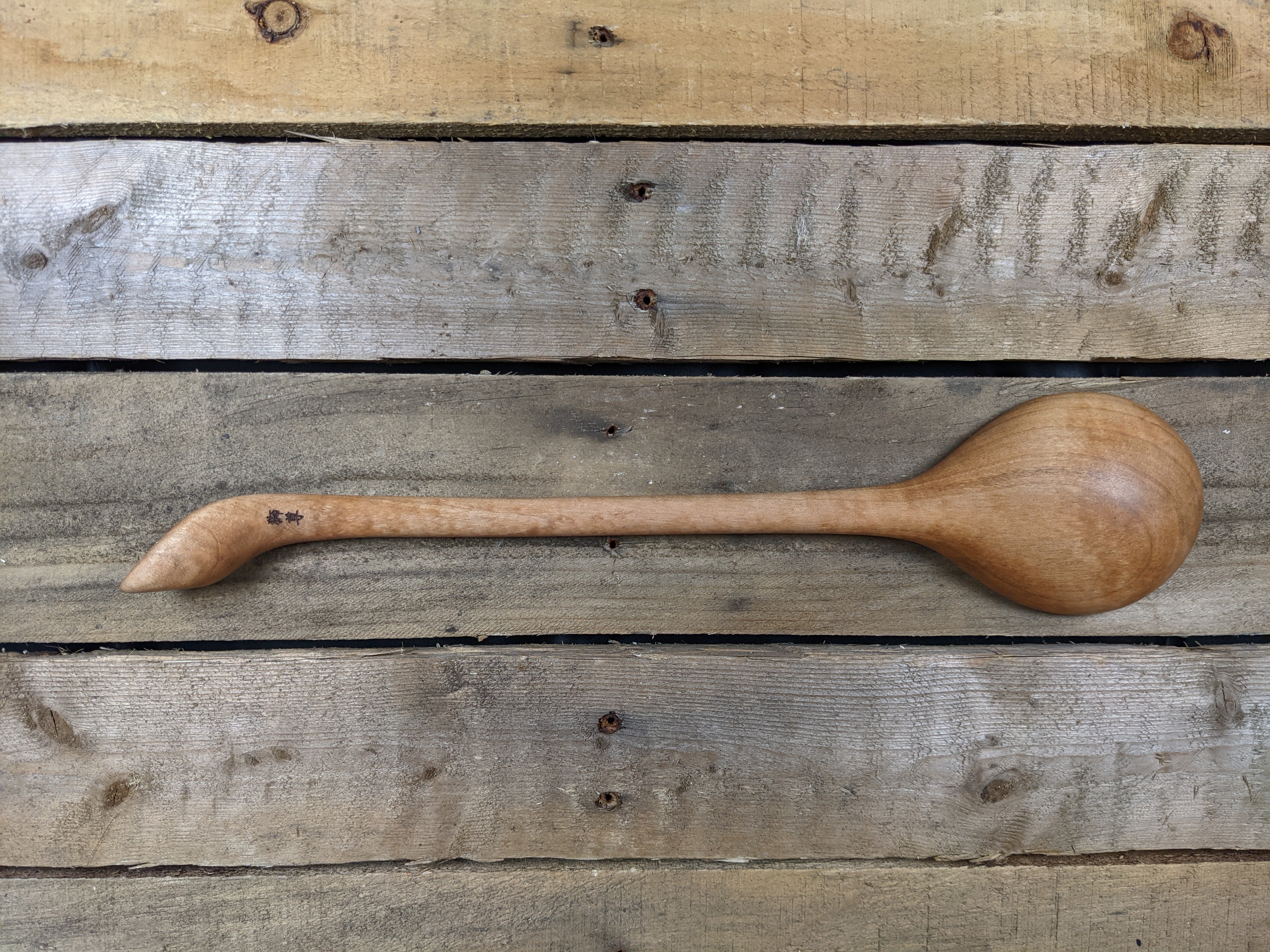 Long handled wooden spoon